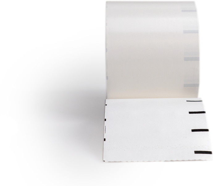 Roll of white label paper with black timing marks along the edge